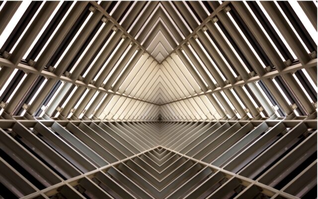Interior of metal structure, appearing in a diamond geometric shape.