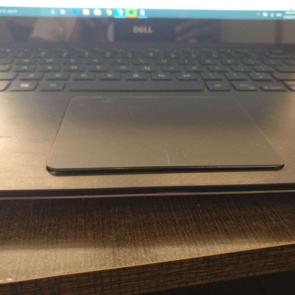 XPS 15-9560, touchpad popping out | DELL Technologies
