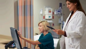 Two female medical professionals in a clinic setting