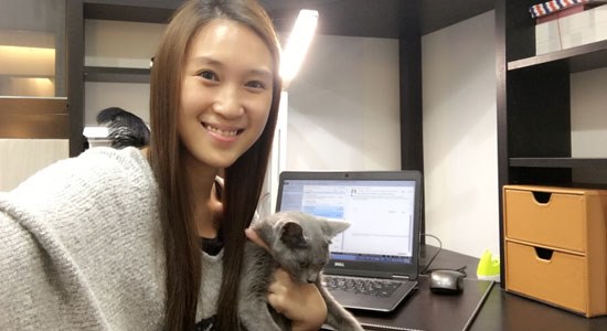 Dell Taiwan employee Lina Hsieh in her home office with her cat