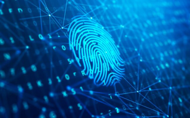 Scanned fingerprint against a digital background, representing biometric security.