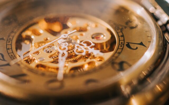 Intricate workings of a gold watch's mechanism, requiring attention to detail and engineering skill.