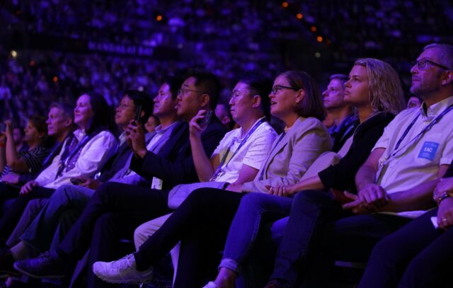 Audience members at the 2023 Dell Technologies World listen to the Day One Keynote address. 