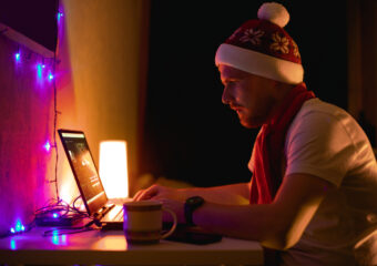 holiday freelancer working in laptop at the home. Nice color light in the room. Soon happy New year. holiday it support