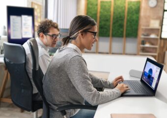Two designers working in the office on the Dell Pro Max 16 Premium Touch. Image of a screenfill with design software.